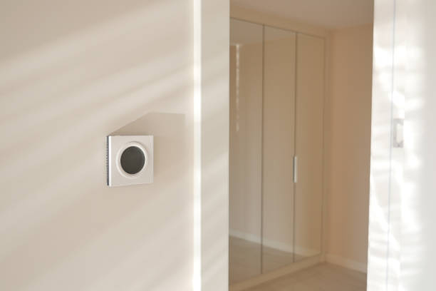 istock Smart Thermostat on White Wall for Optimal Home Temperature Control 2160108867