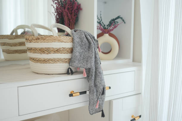 istock Create a welcoming entryway with stylish decor a basket and blanket on a white cabinet 2160109404