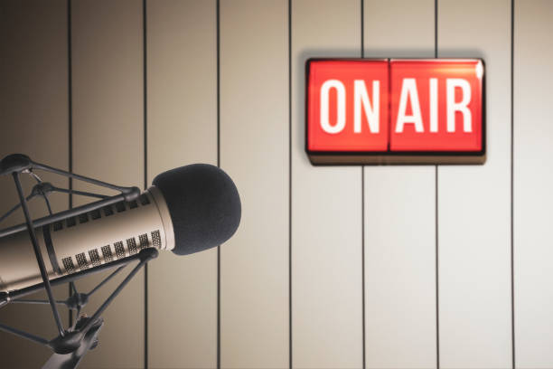 istock Professional microphone and on air sign 2160114133