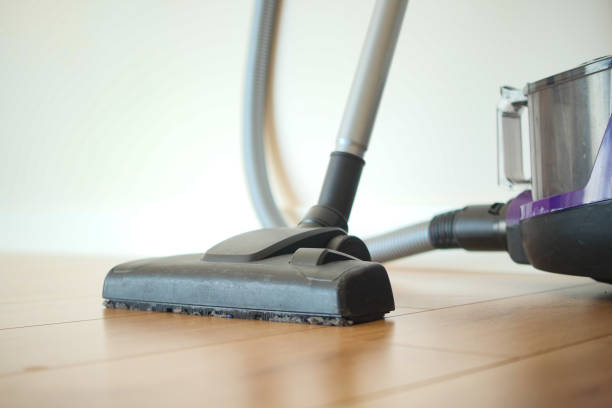 istock cleaning floor dust with vacuum cleaner. 2160115891