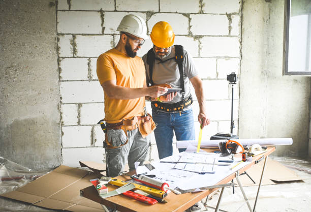 istock workers are doing repairs in the apartment 2160116655