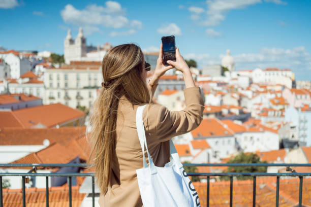 istock A well-dressed woman is walking through a modern building with interesting architecture. 2160117758