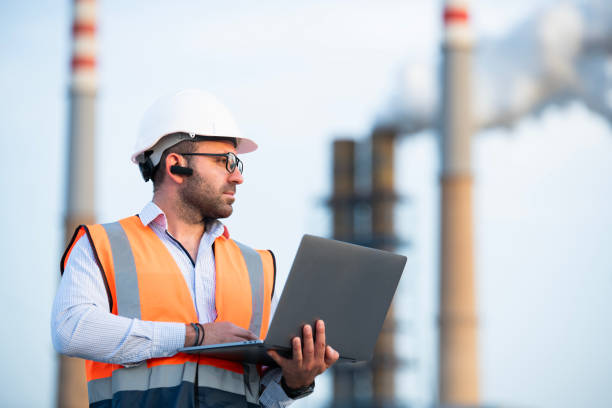 istock Engineer working at petrol refinery plant site. 2160118424
