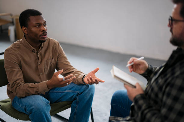 istock African man sharing his anxiety problems with the counselor 2160120745