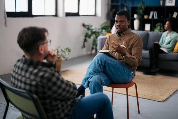 istock African psychotherapist providing counseling to a patient during a therapy session 2160120875