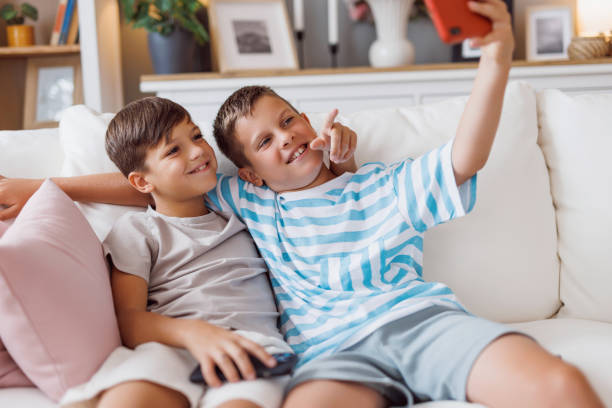 istock Boys enjoying themselves taking a fun-filled selfie. 2160126168