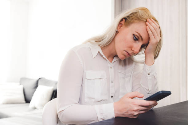 istock Person frustrated with computer warning symbols on monitors 2160126824