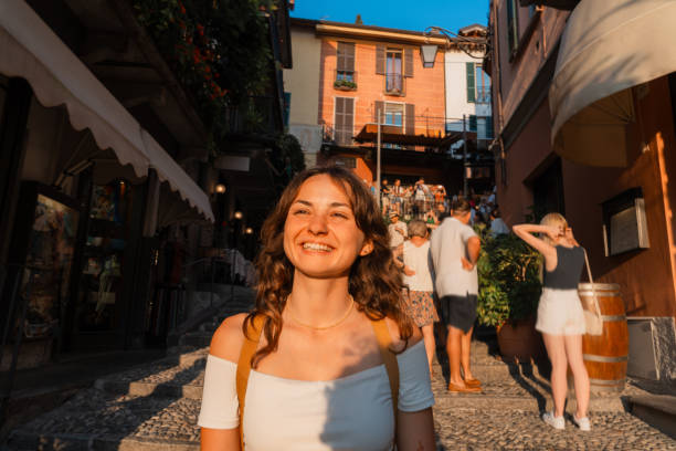 istock Woman on vacation at lake Como exploring old town 2160128437