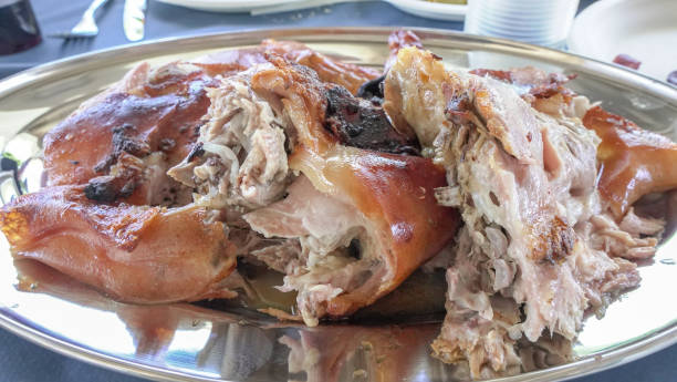 istock Chopped suckling pig with plate served on a silver platter 2160128455