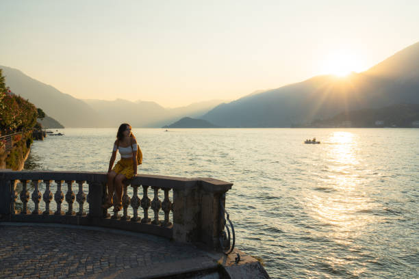 istock Woman on vacation at lake Como exploring old town 2160128578
