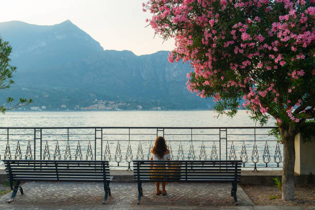 Woman on the lakeside of Gardone Riviera, known as the \