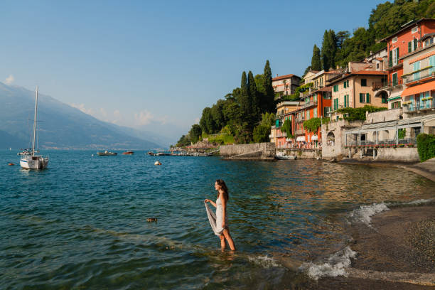 istock Woman on vacation at lake Como 2160128850