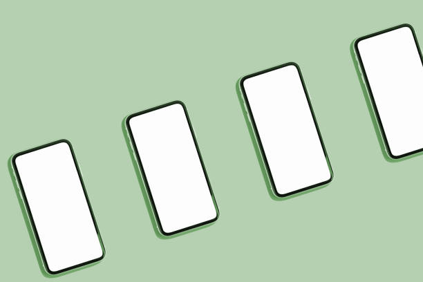 istock Smartphones with blank white screens, demonstrating copy space for app or ad design, on green background 2160133699