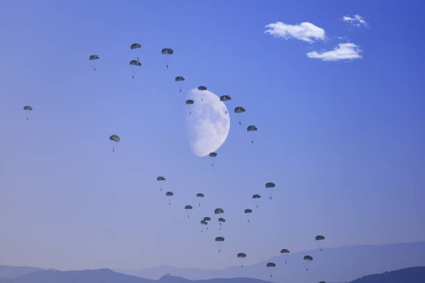 Group of three parachutist against blue sky. Sport, hobby background