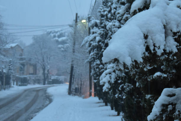 istock A winding road covered with snow 2160141347
