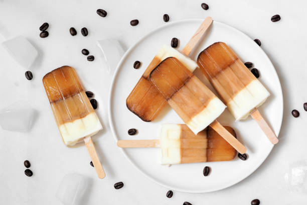 istock Plate of coffee and cream popsicles against white marble 2160142517