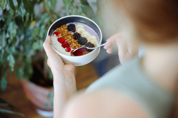 istock Smoothie bowl with fresh berries and granola 2160142973