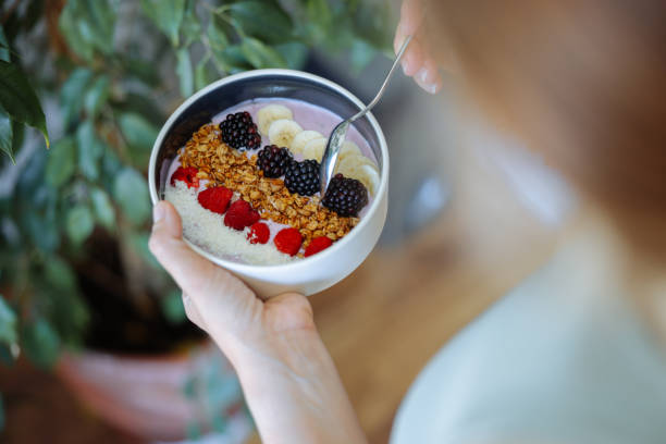 istock Smoothie bowl with fresh berries and granola 2160143340