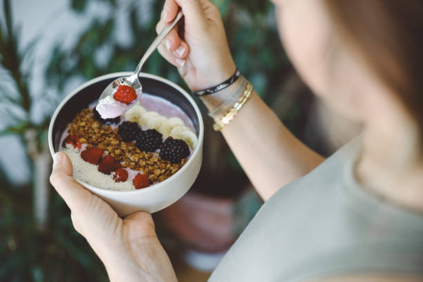 istock Smoothie bowl with fresh berries and granola 2160143534