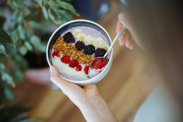 istock Smoothie bowl with fresh berries and granola 2160143587