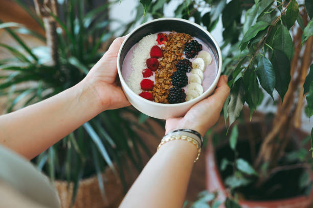 istock Smoothie bowl with fresh berries and granola 2160143737