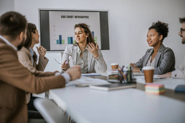 istock Business meeting with colleagues around a table in a modern office 2160144285
