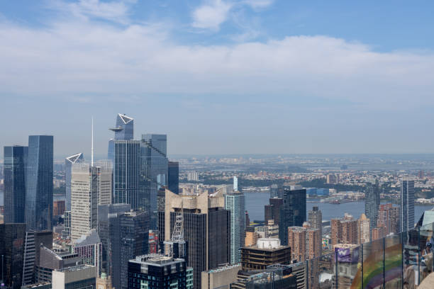 New York, New York, USA - June 19, 2024: This image shows a cityscape view of midtown Manhattan skyline on a sunny day.