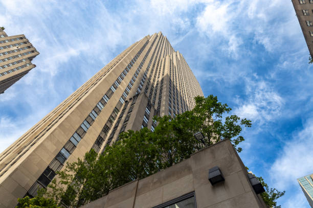 New York, New York, USA - June 19, 2024: View of the exterior of 30 Rockefeller Plaza in Midtown Manhattan. The 66-story Art Deco building was constructed in 1933.