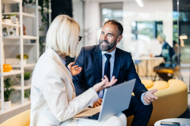 istock Engaged coworkers discussing business strategy 2160152684