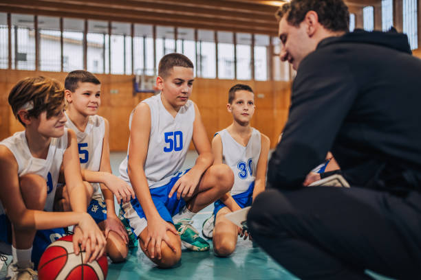 istock Kids engaging with a basketball strategy talk 2160153326