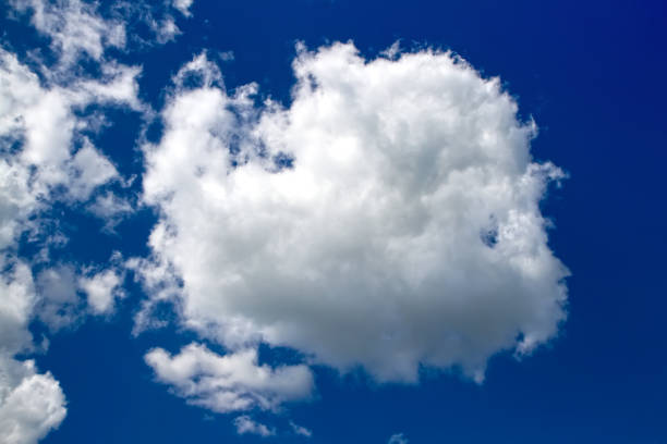 istock A white cumulus cloud in a blue sky. 2160158566