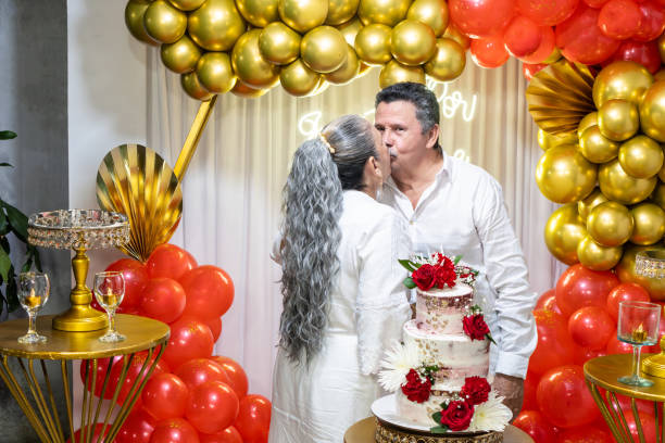 istock Elderly Couple Sharing a Kiss on 40th Wedding Anniversary 2160158671