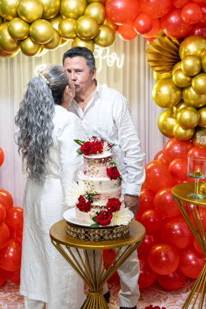 istock Latin Couple Sharing a Kiss on 40th Wedding Anniversary 2160158678