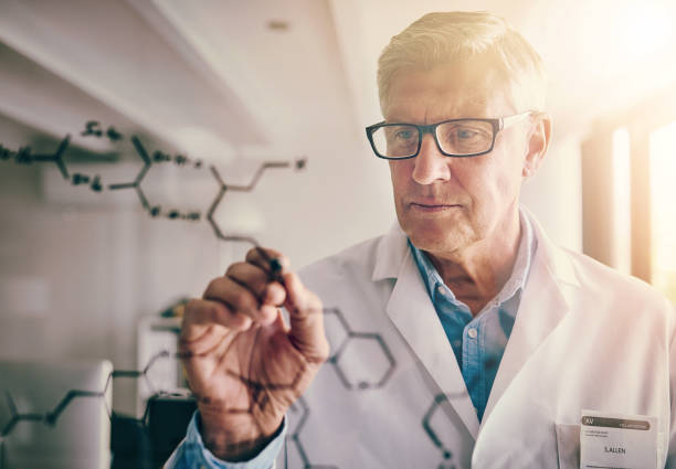 crazy scientist looking thought  glasses in camera