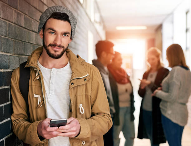 istock Student, man and portrait with smartphone on university for e learning application, digital literacy and higher education. Male learner, online and internet for academic registration and scholarship. 2160160248