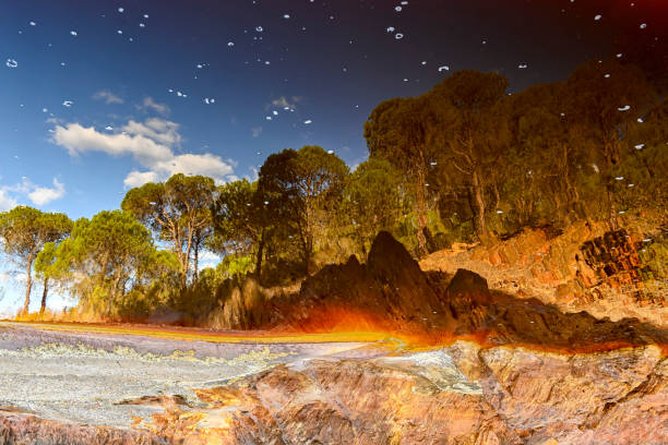 The tranquil waters of Rio Tinto reflect the surrounding landscape with striking clarity.