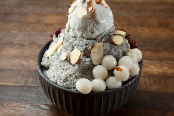 black sesame bingsu A view of a bowl of black sesame bingsu. red bean dessert stock pictures, royalty-free photos & images