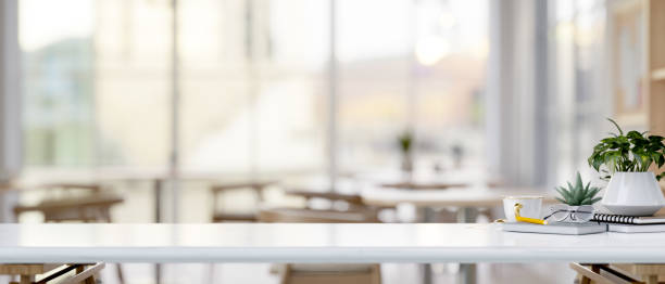 istock A white tabletop with a copy space and decorative stuff in a comfortable coffee shop or restaurant. 2160172249