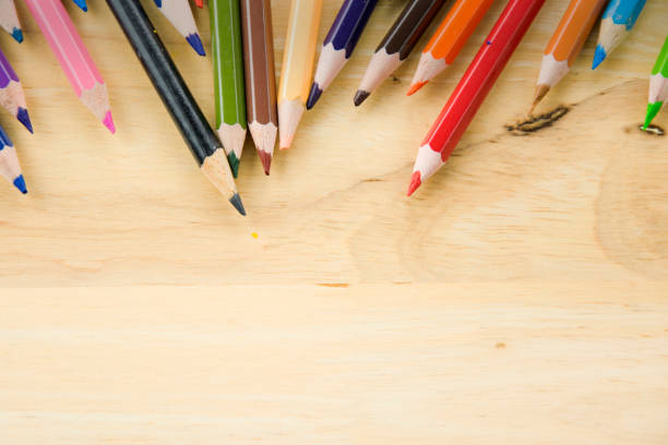 Color image depicting a close up macro abstract view of a collection of colored pencils.
