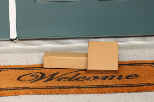 istock Delivered packages on welcome mat 2160175296