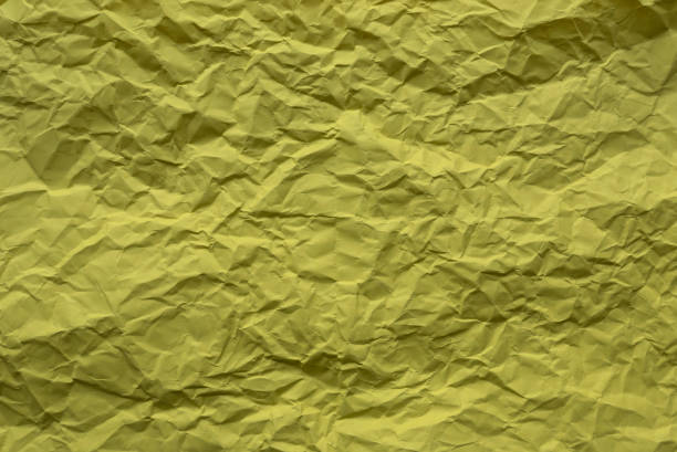 Yellow color crumpled paper for background.