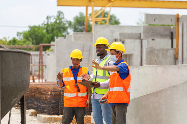 istock Foreman and worker team discussing at precast concrete factory site, Construction workers at work 2160181979