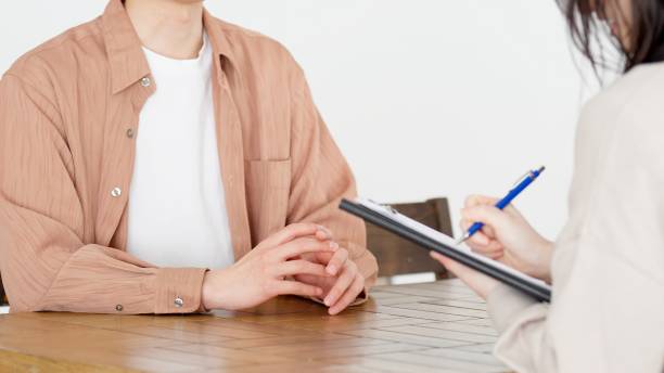 istock Man being interviewed by woman 2160182358