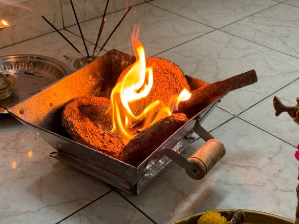istock Closeup of havan pot with fire and cowdung 2160184199