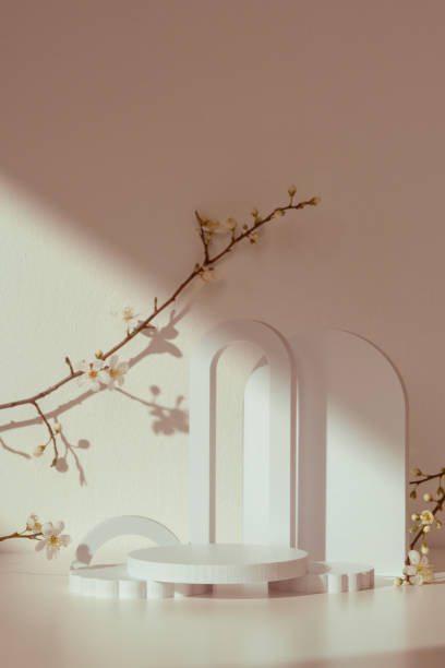 istock Blooming spring branches with flowers and its shadow on beige background 2160184790