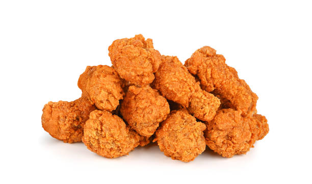 istock Fried spicy chicken wings isolated on white 2160190252