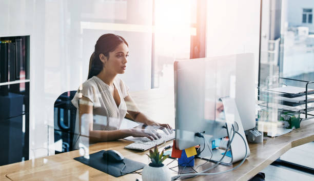 Business, girl and typing on computer in office for administrative work, document management and reception duty. Woman, technology and email communication, professional and online for task schedule.
