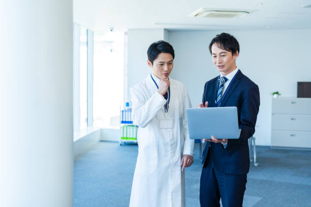 istock Businessman having a meeting with a doctor 2160193032