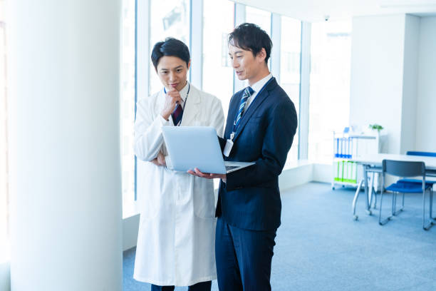 istock Businessman having a meeting with a doctor 2160193034