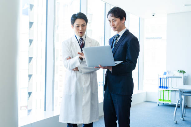 istock Businessman having a meeting with a doctor 2160193042